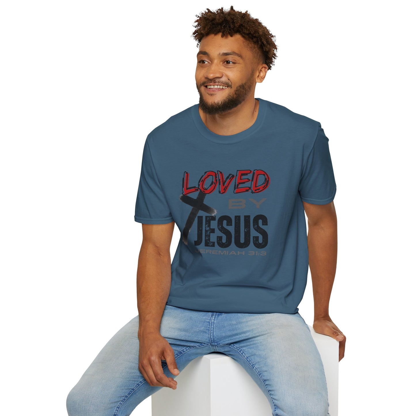 Man wearing indigo blue Christian graphic t-shirt with Loved by Jesus text and cross design
