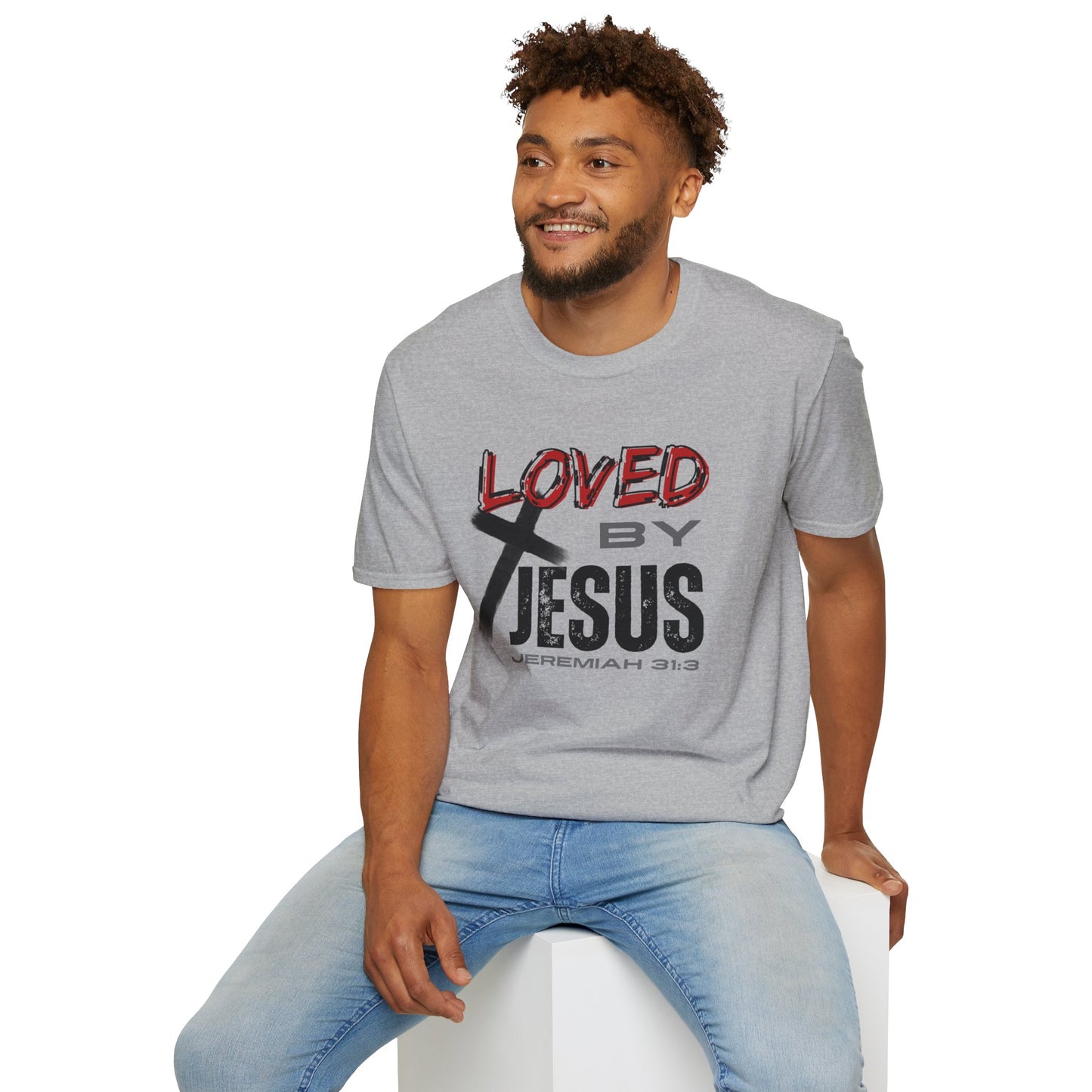 Sport grey Christian graphic t-shirt with Loved by Jesus design worn by smiling man