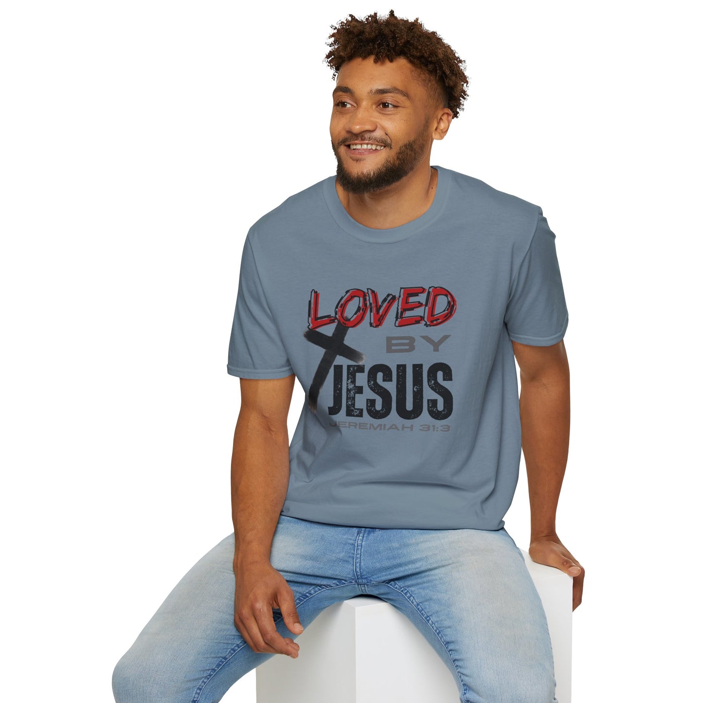Man wearing a stone blue Christian graphic t-shirt with Loved by Jesus design and Jeremiah 31:3 scripture