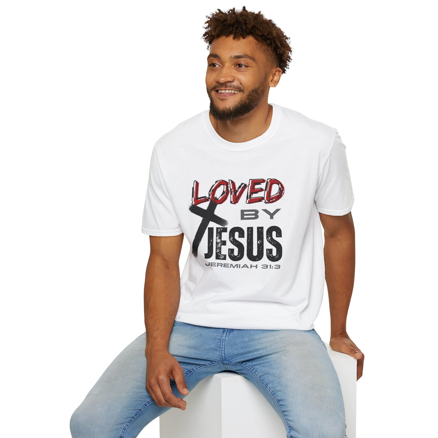 Man wearing white Christian graphic t-shirt with Loved by Jesus text and cross design