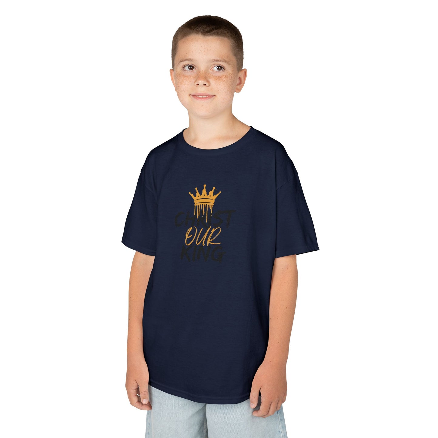 Christian junior kids t-shirt in navy blue with gold crown and Our King design worn by boy