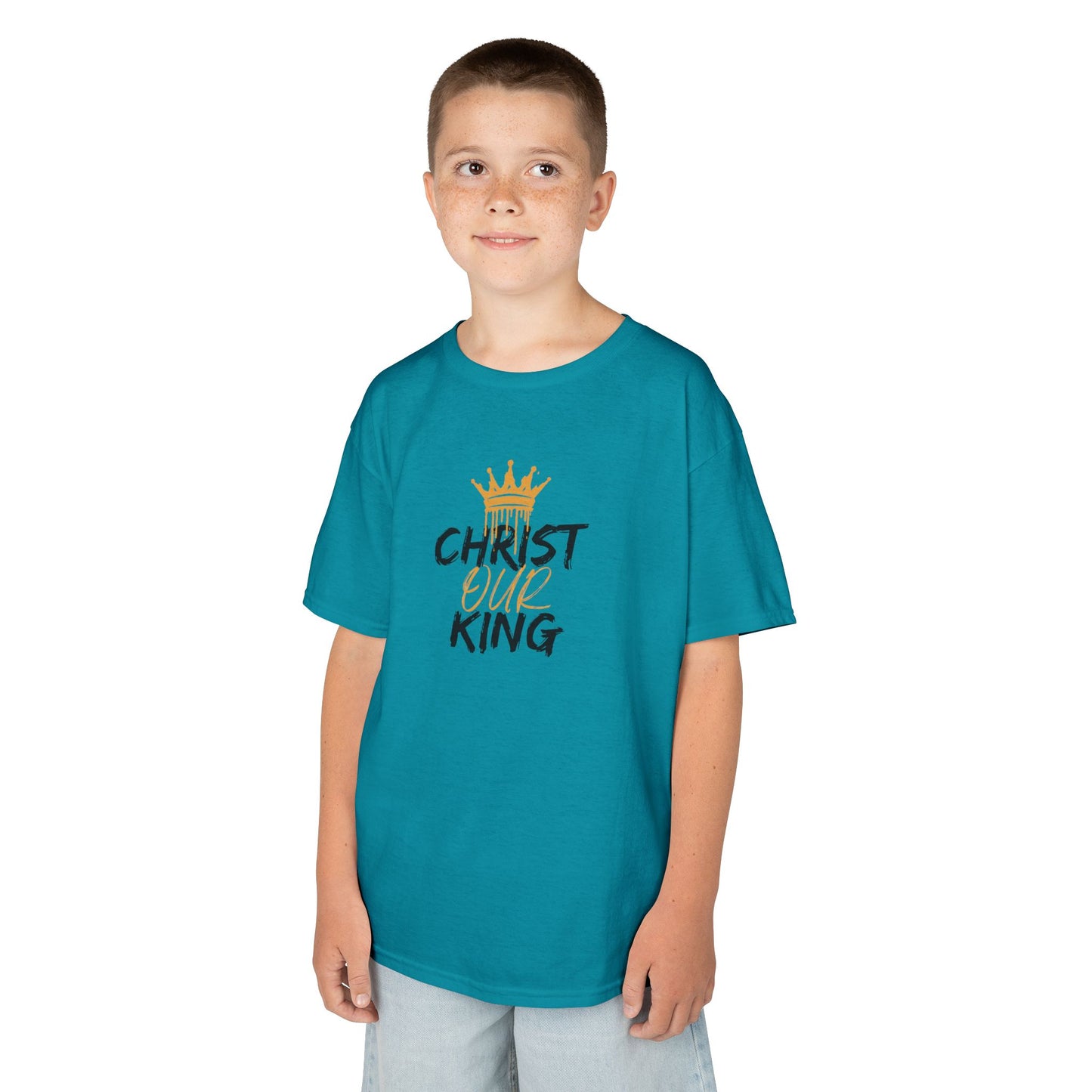Christian junior kids t-shirt in teal with Christ our King text and gold crown design worn by boy