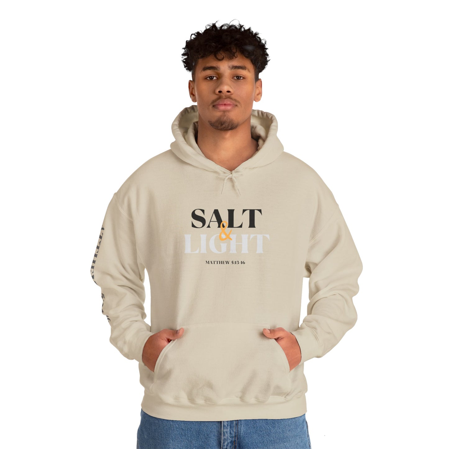 Beige Logos Co. Salt & Light - Christian scripture hoodie worn by a man with both hands in front pocket
