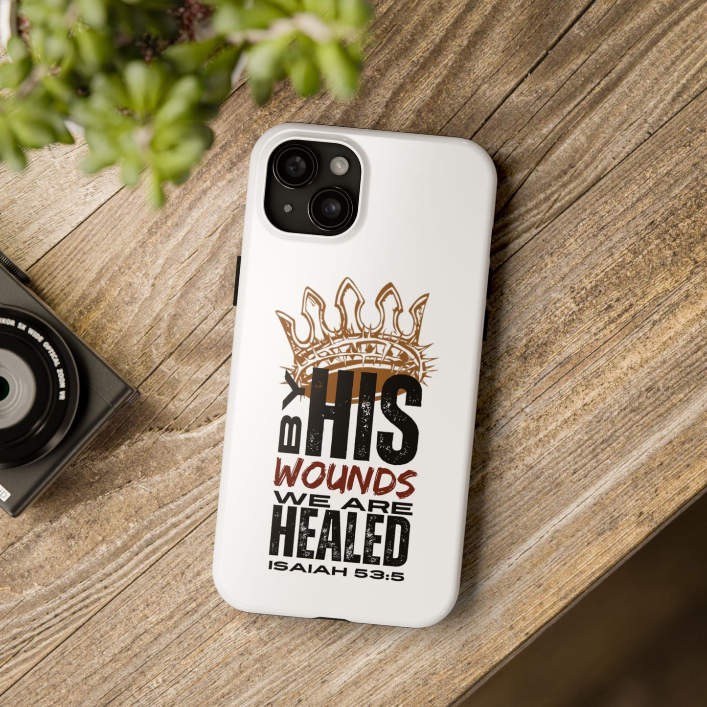 White Christian tough phone case with Isaiah 53:5 scripture and crown design on wooden surface