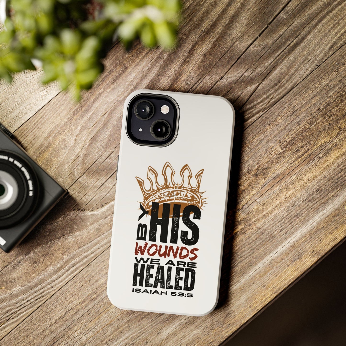 Logos Co. Christian tough iPhone case with Isaiah 53:5 scripture and crown design on white background