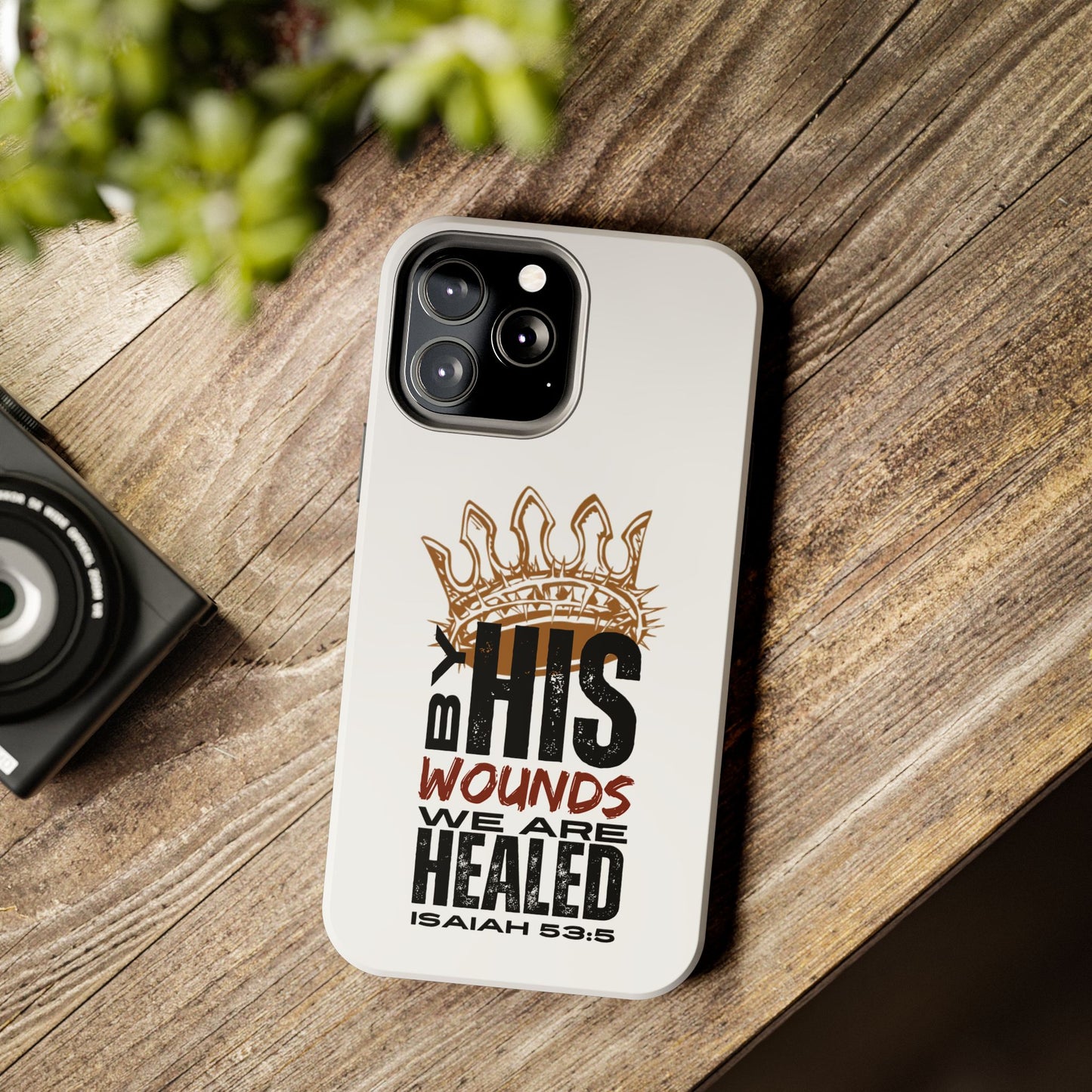 Christian tough phone case by Logos Co. with Isaiah 53:5 scripture and crown design on white background