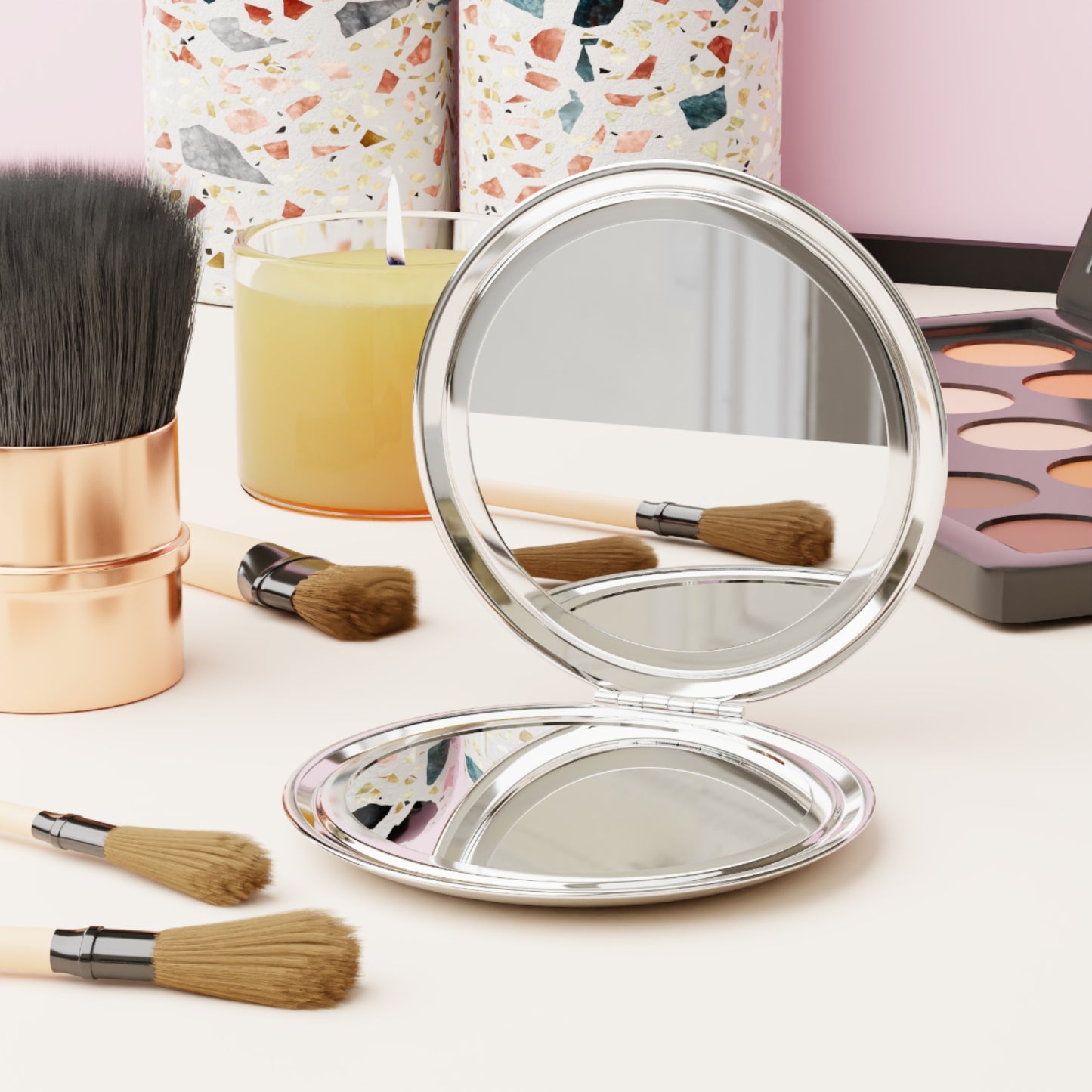 Logos Spirit Lead Me Christian travel mirror with dual mirrored surfaces surrounded by makeup brushes and cosmetics