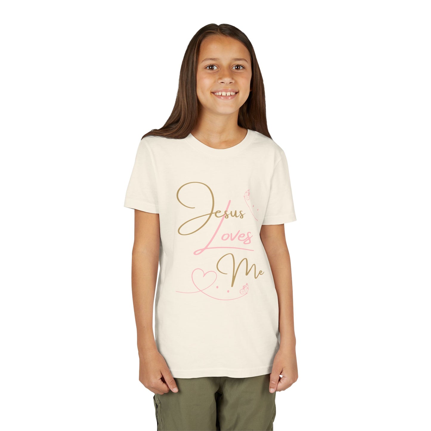 Jesus Loves Me youth shirt on smiling girl in cream tee with pink gold script design by Logos Co.