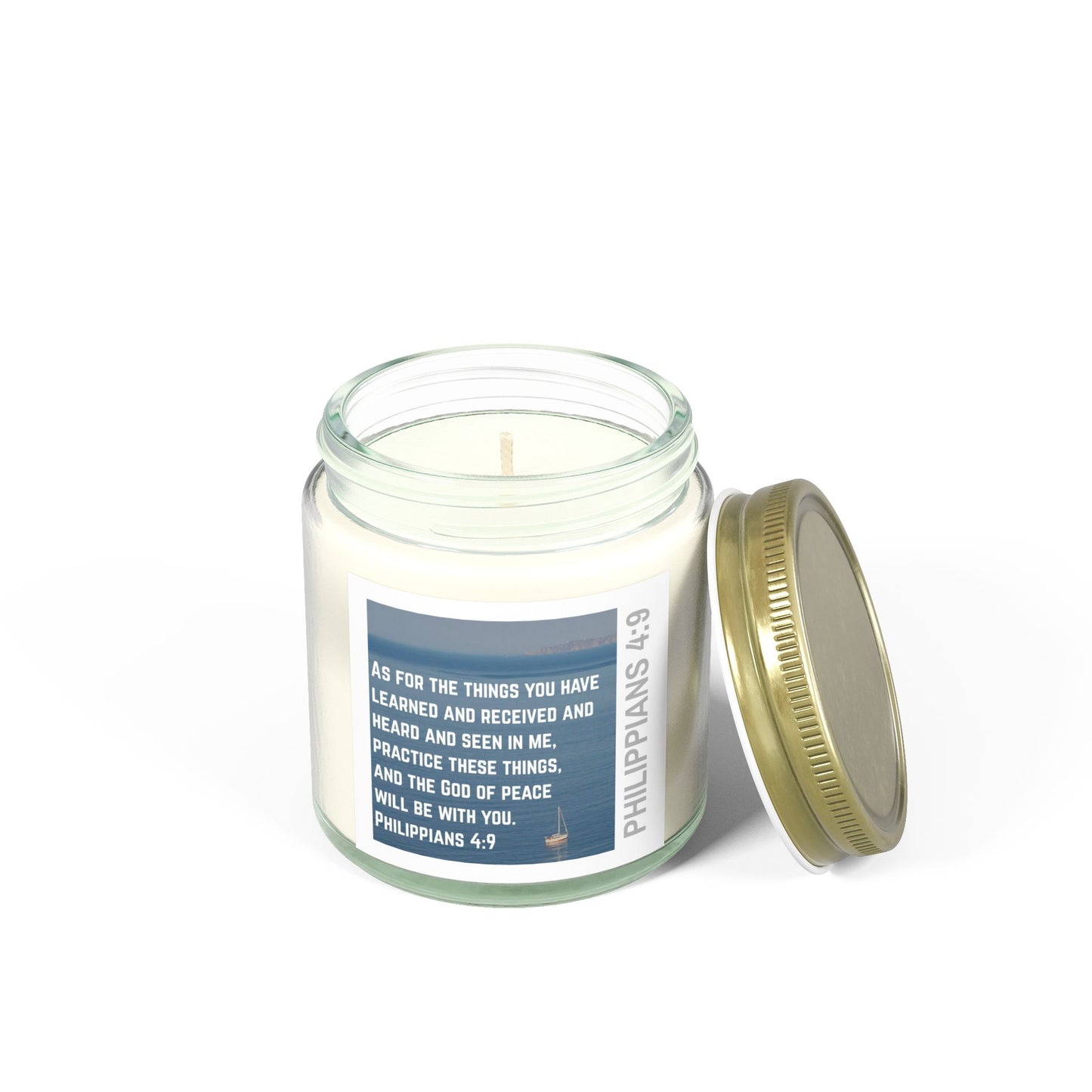 Logos eco-friendly Christian candle in glass jar with Philippians 4:9 scripture label and gold lid