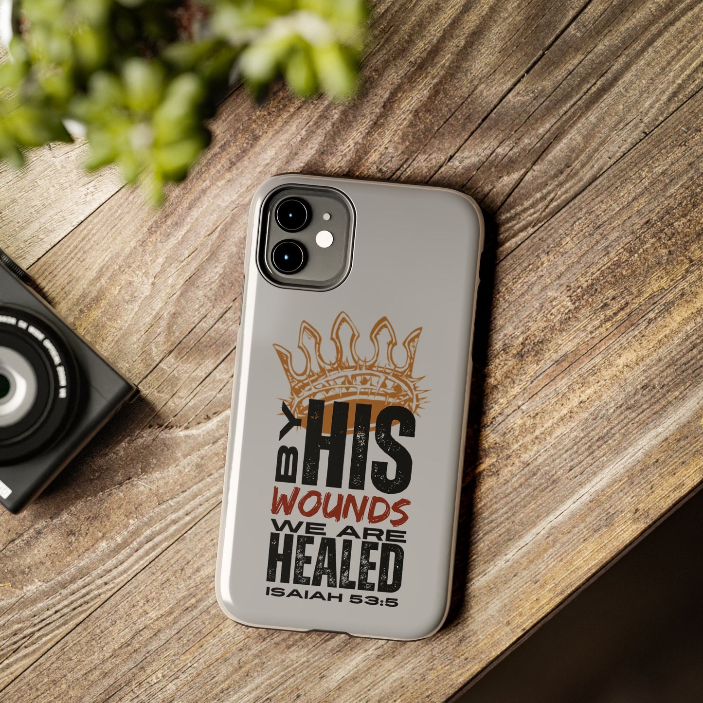 Gray scripture phone cover with Isaiah 53:5 design featuring crown and healing message