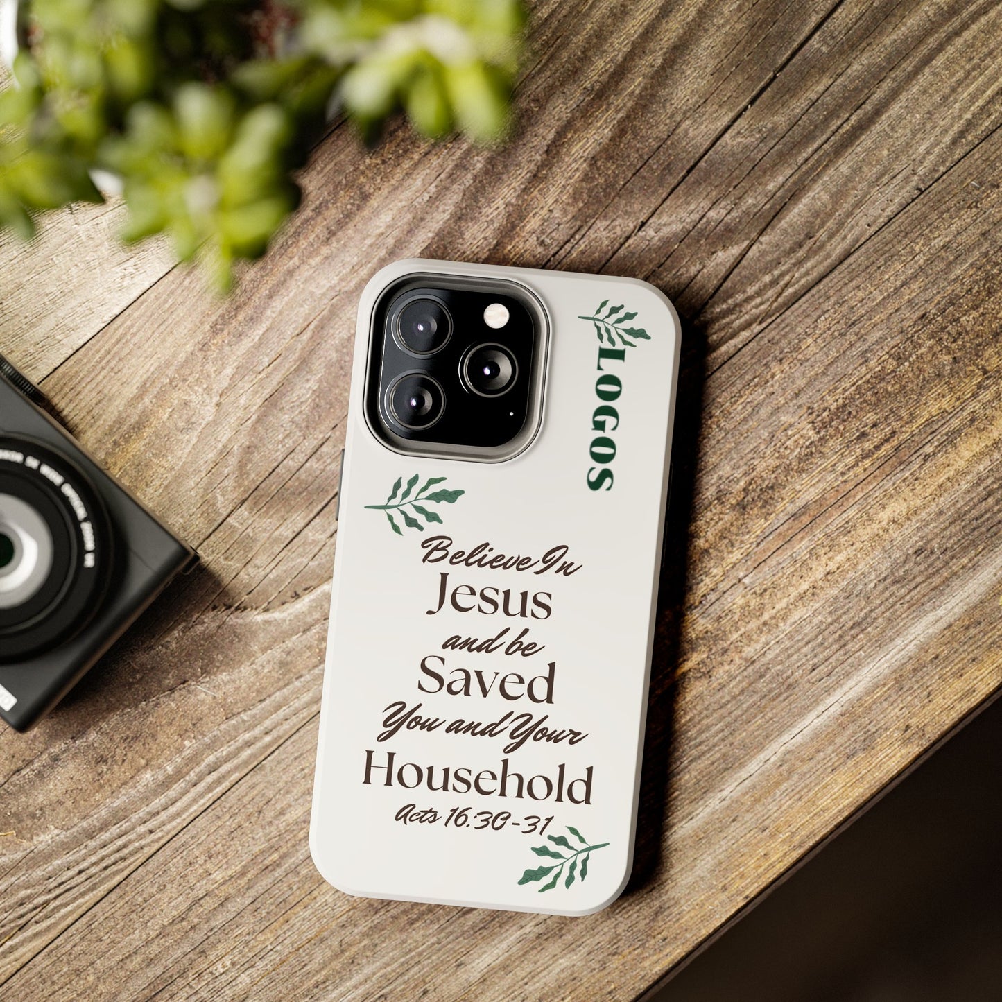 Logos Bible verse tough phone case with inspirational scripture design on a wooden surface
