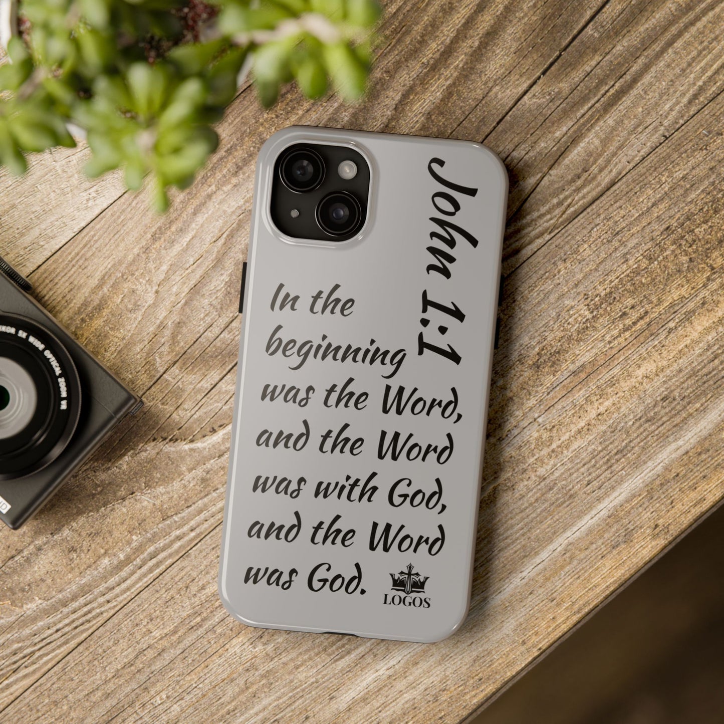 Bible verse phone case with John 1:1 scripture text on a gray protective iPhone cover