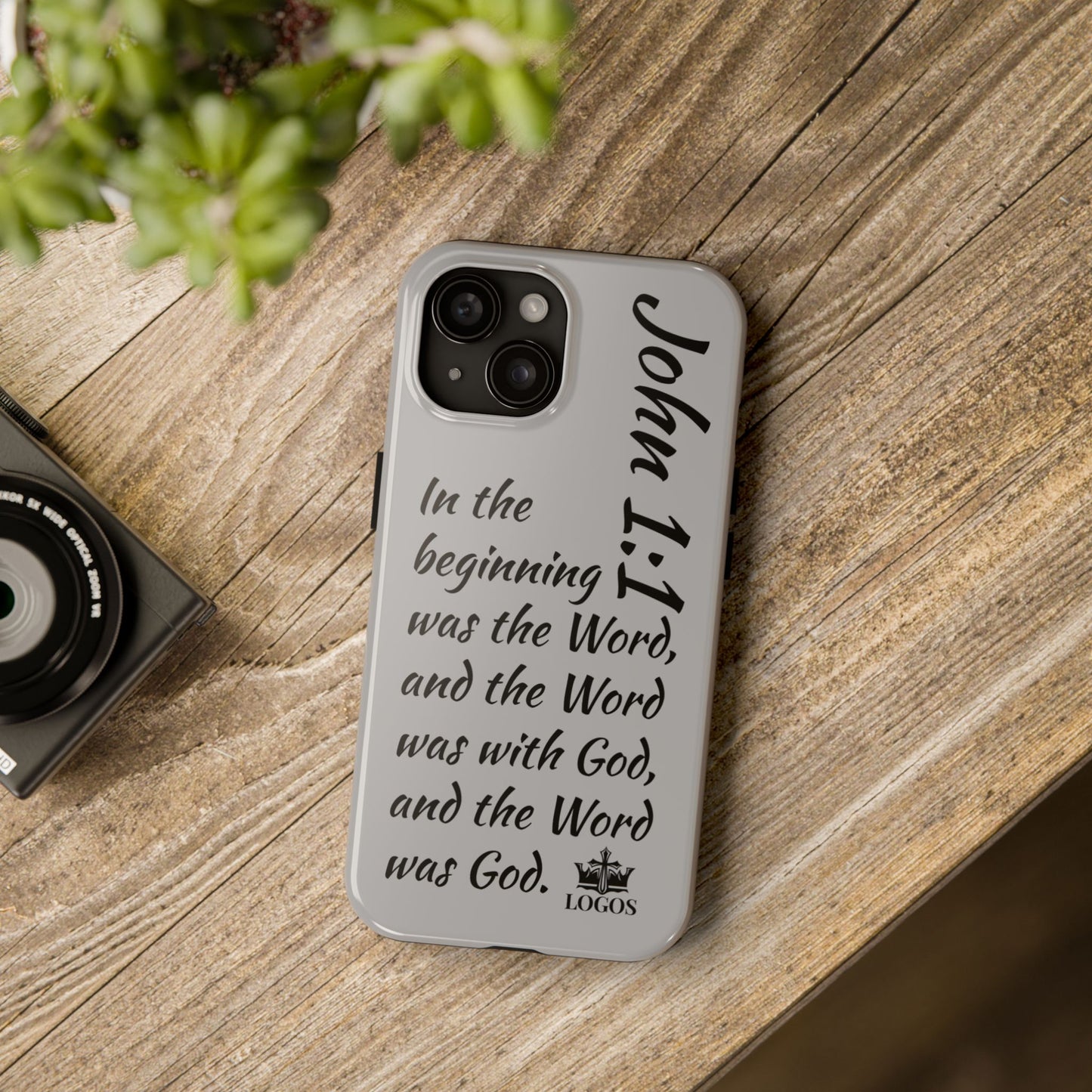 Logos Bible verse phone case featuring John 1:1 scripture text on a gray protective cover