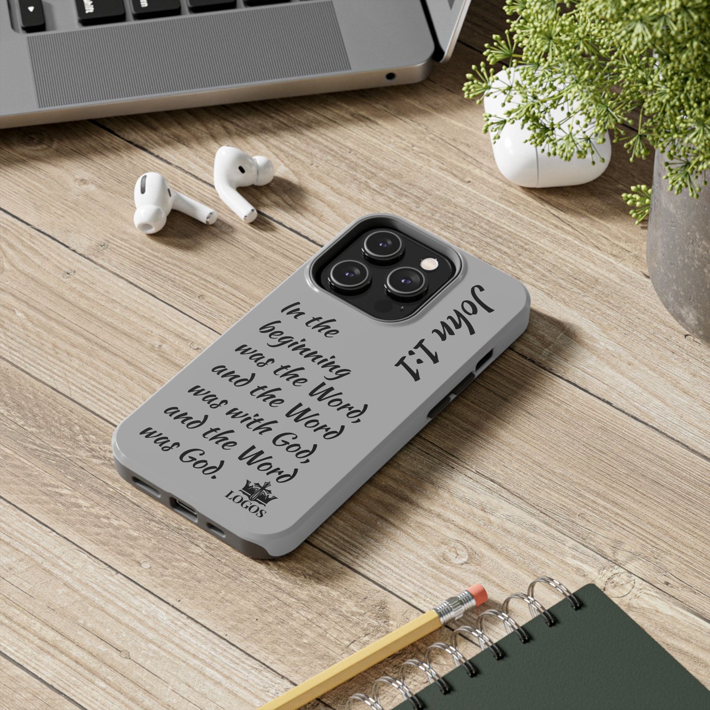 Logos Co. Bible verse phone case with John 1:1 scripture design on gray protective cover