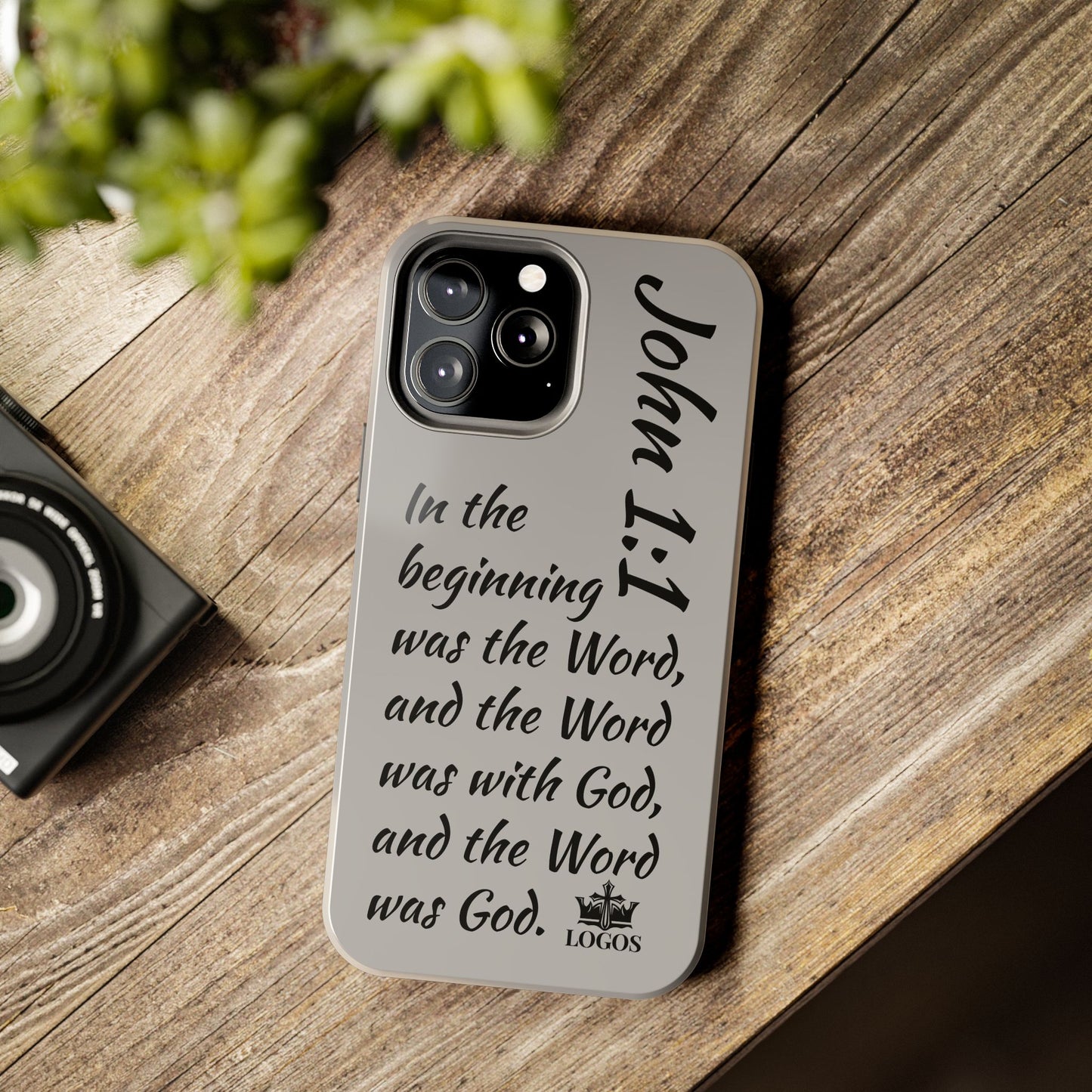Bible verse phone case from Logos featuring John 1:1 scripture on a gray background