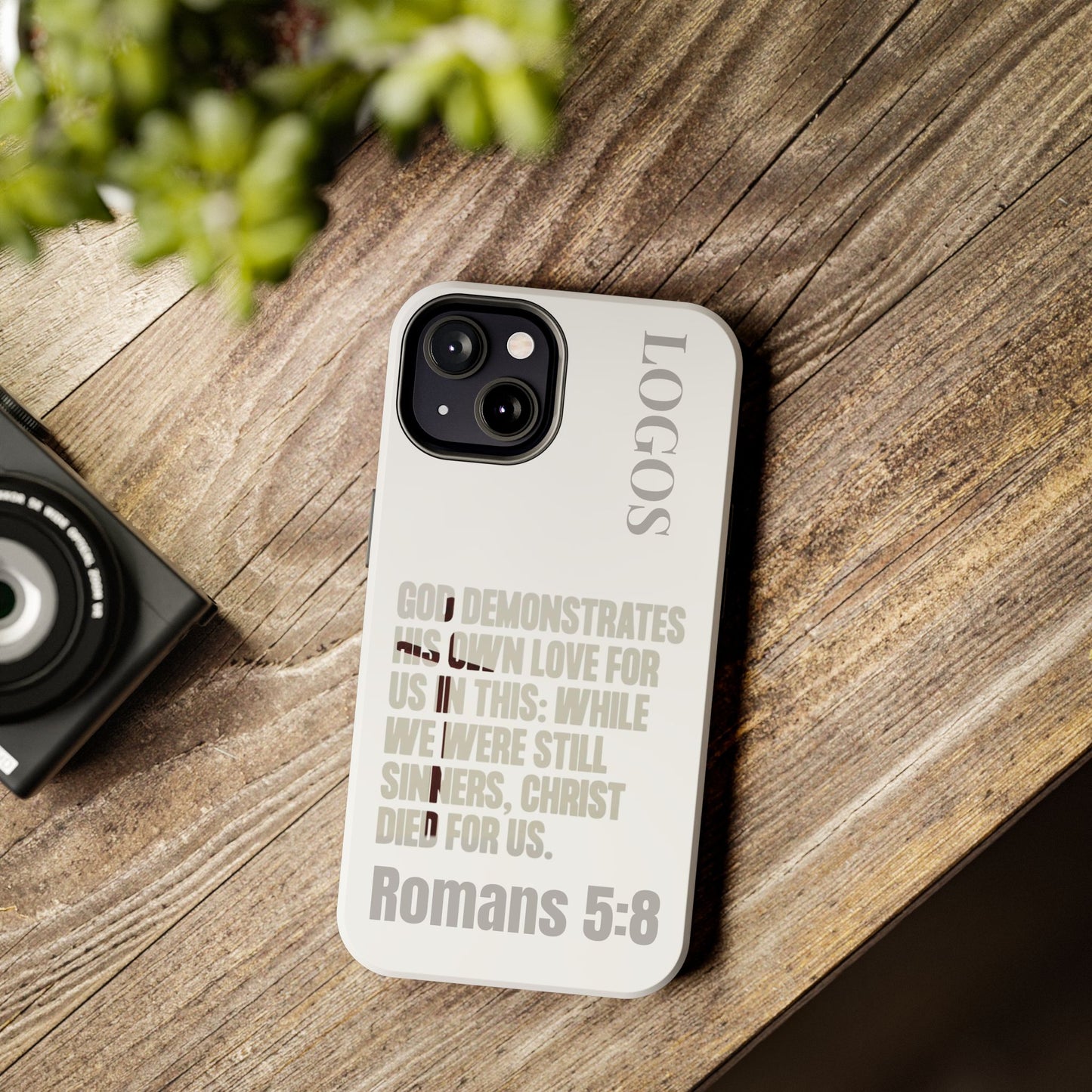 Logos Co. faith-based tough cases featuring Romans 5:8 scripture on a durable phone case