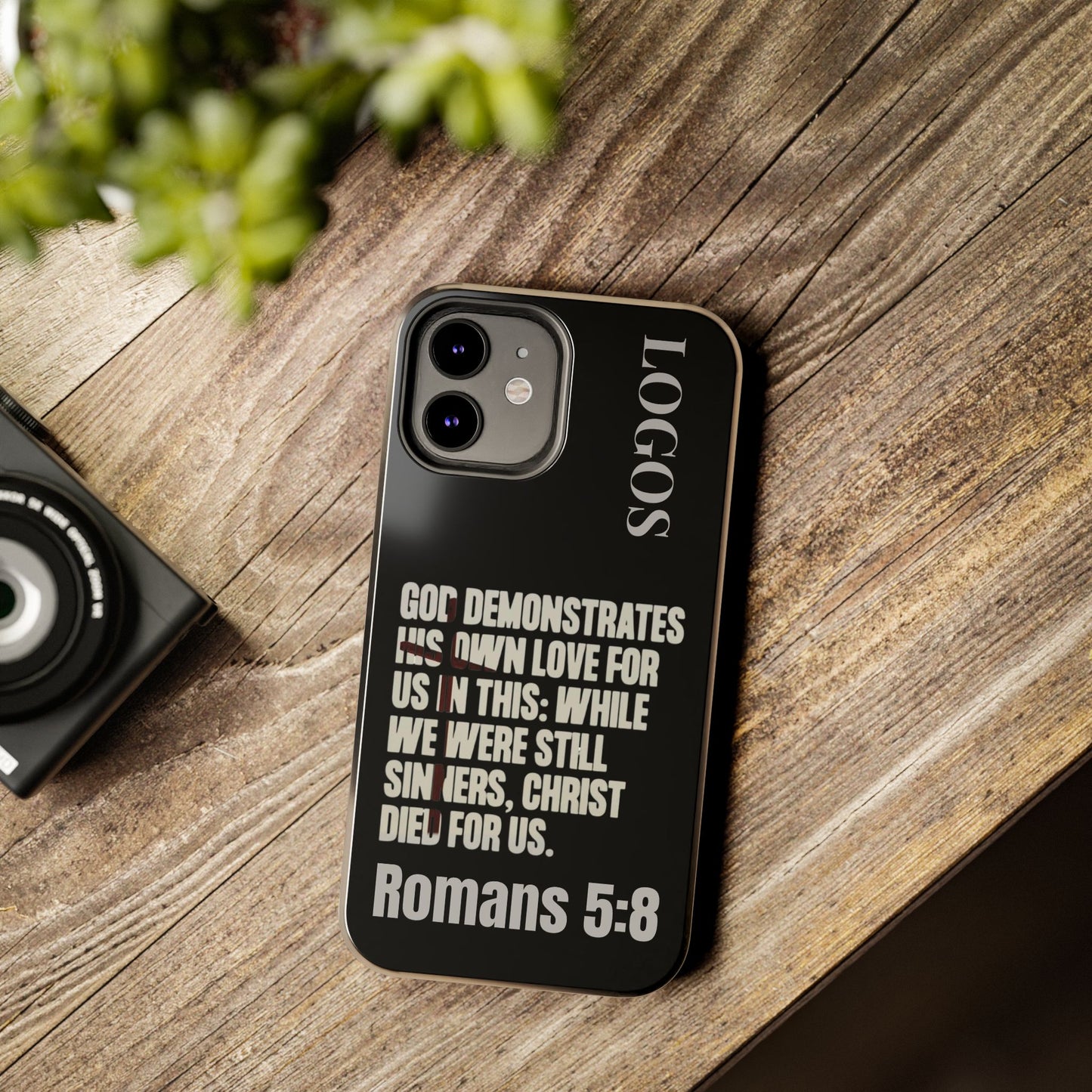 Black Romans 5:8 phone case with inspirational biblical quote and LOGOS text