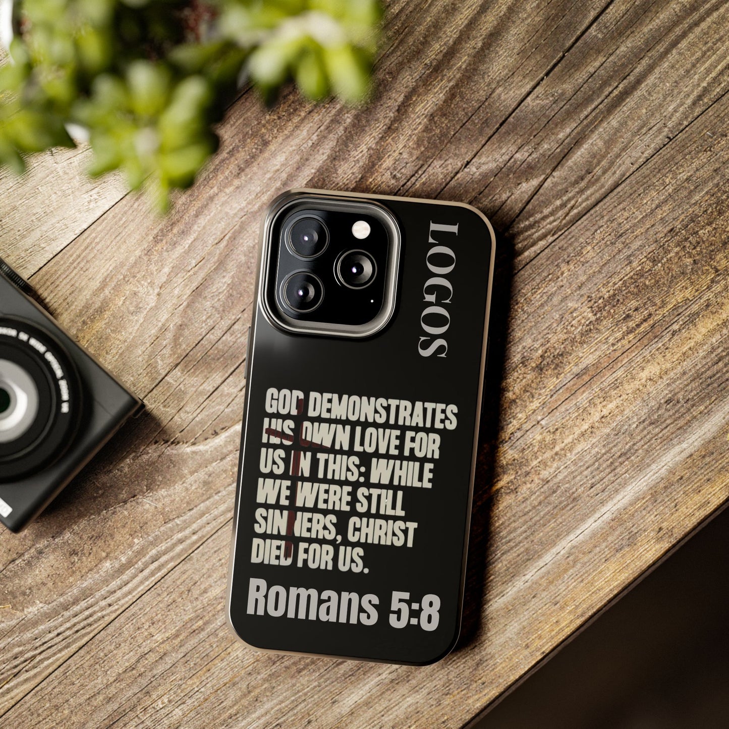 Logos Romans 5:8 phone case with inspirational Bible verse and sleek black design for iPhone
