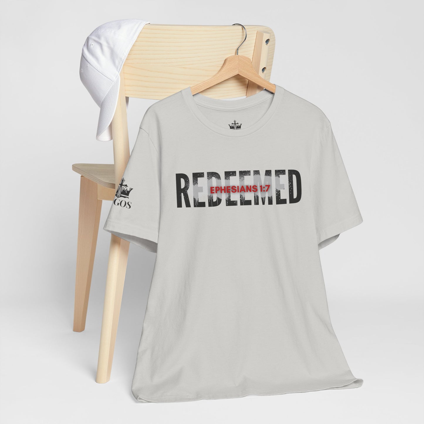 Light gray Redeemed t-shirt featuring Ephesians 1:7 for a stylish faith-inspired look