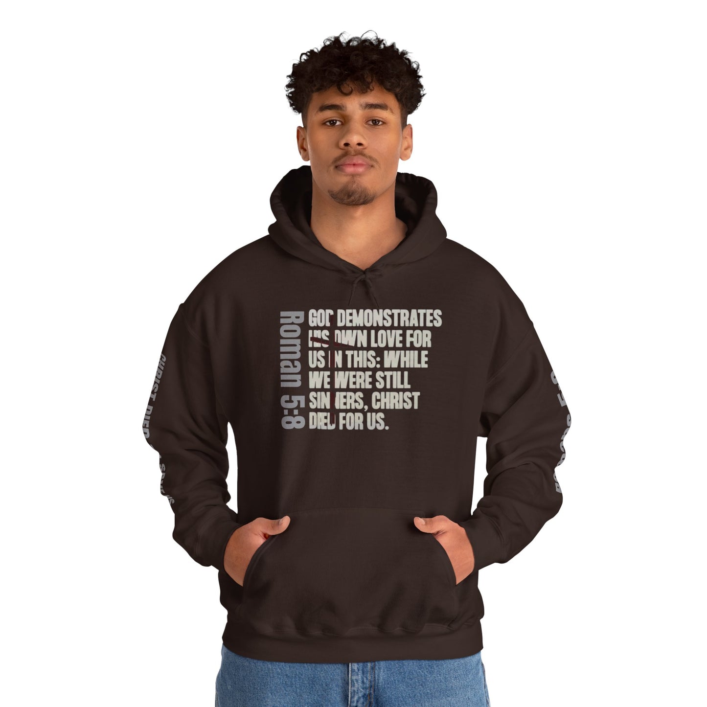 Brown Logos Co. hoodie with Romans 5:8 faith hoodie scripture text design worn by man