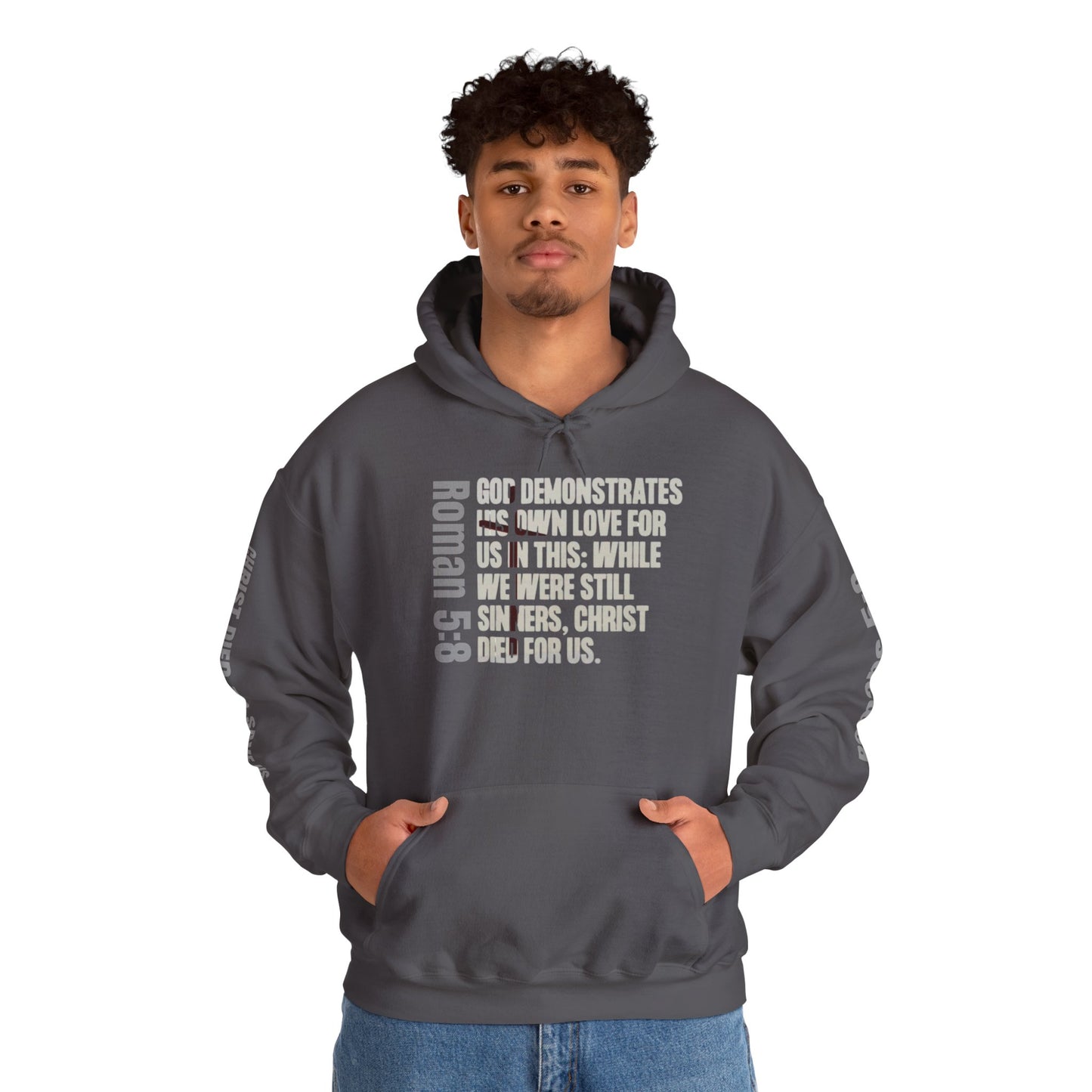 Logos Co. Romans 5:8 hoodie in dark gray with scripture text worn by man