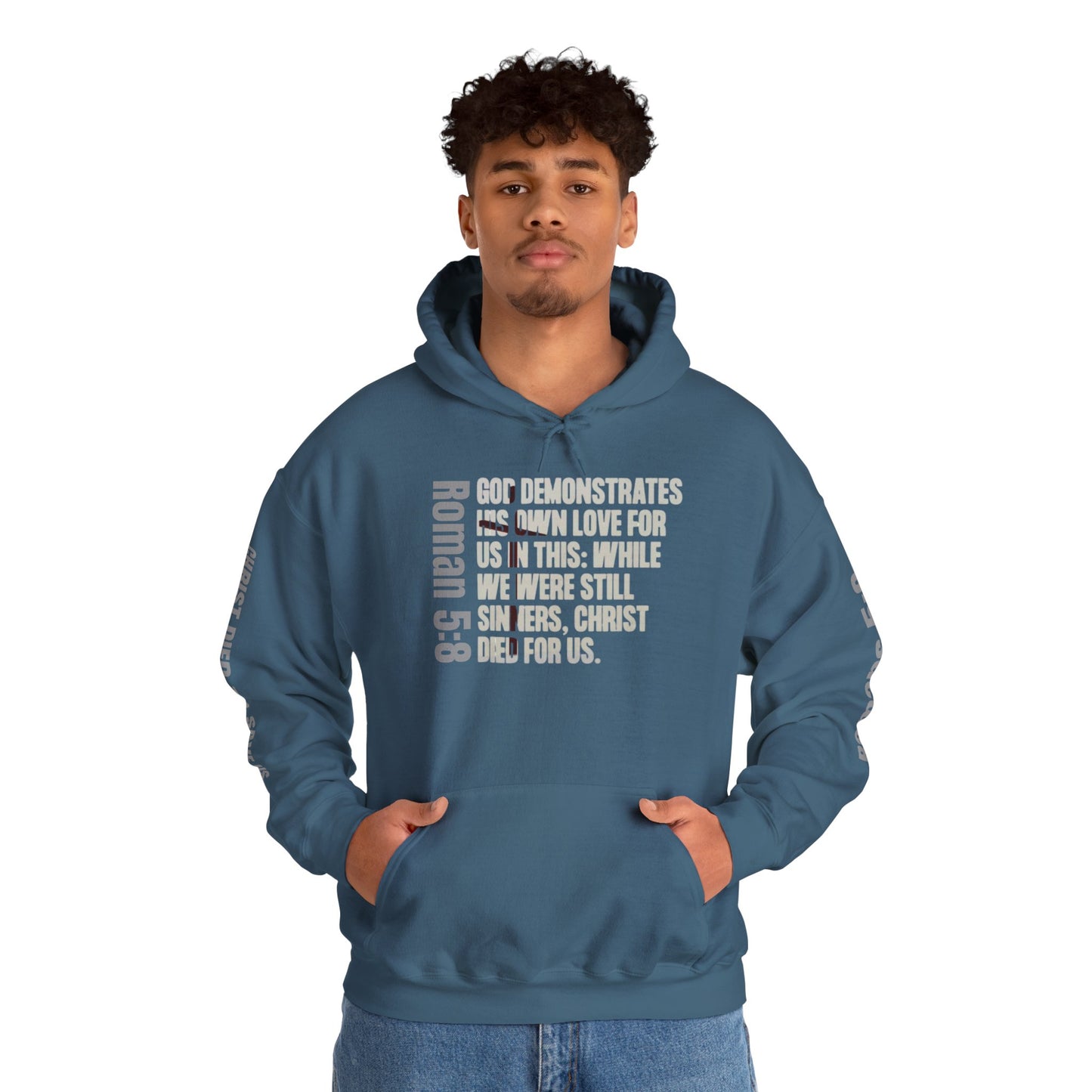 Romans 5:8 hoodie in Indigo blue with inspirational biblical text on front worn by man