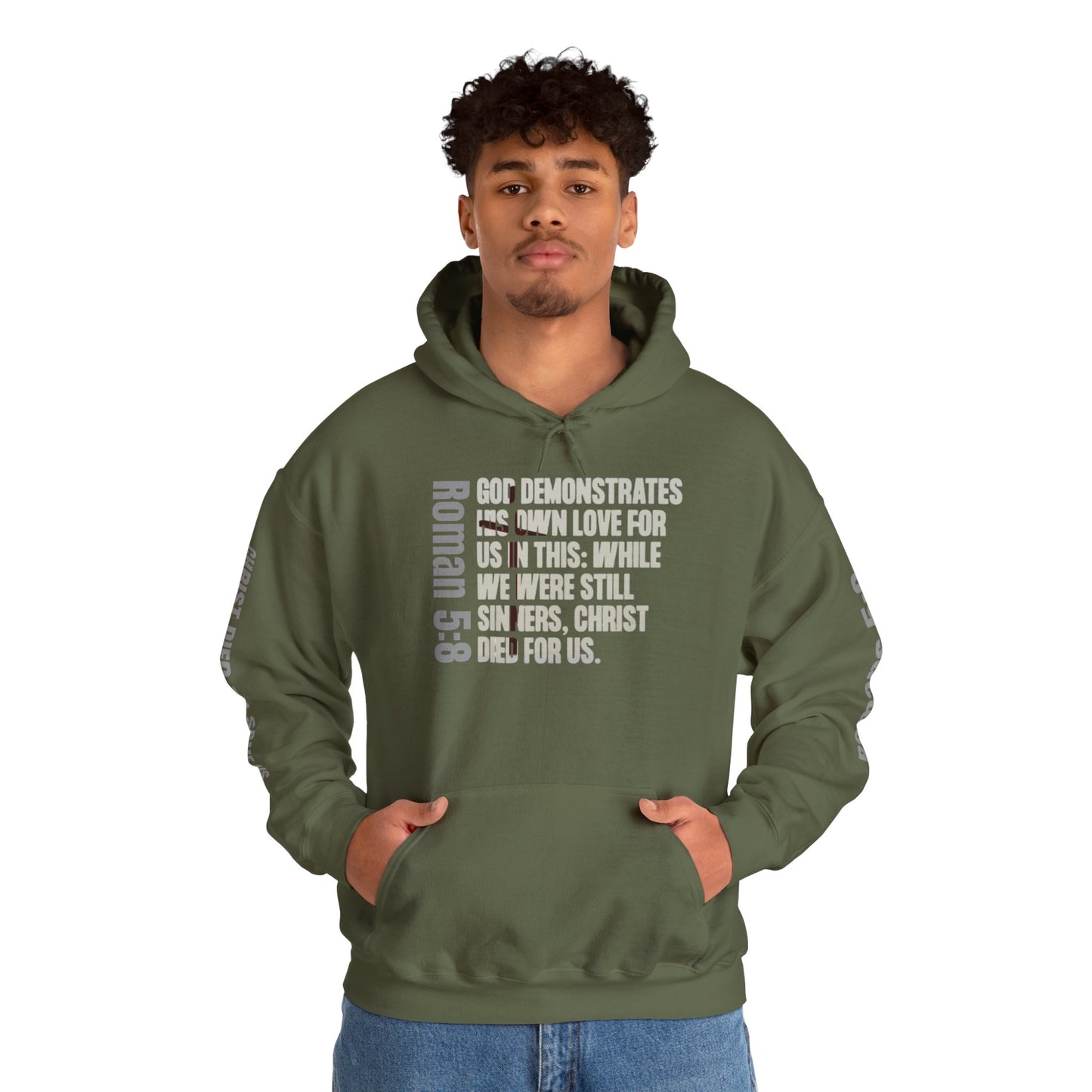 Romans 5:8 hoodie in military green with biblical text design on front worn by male model