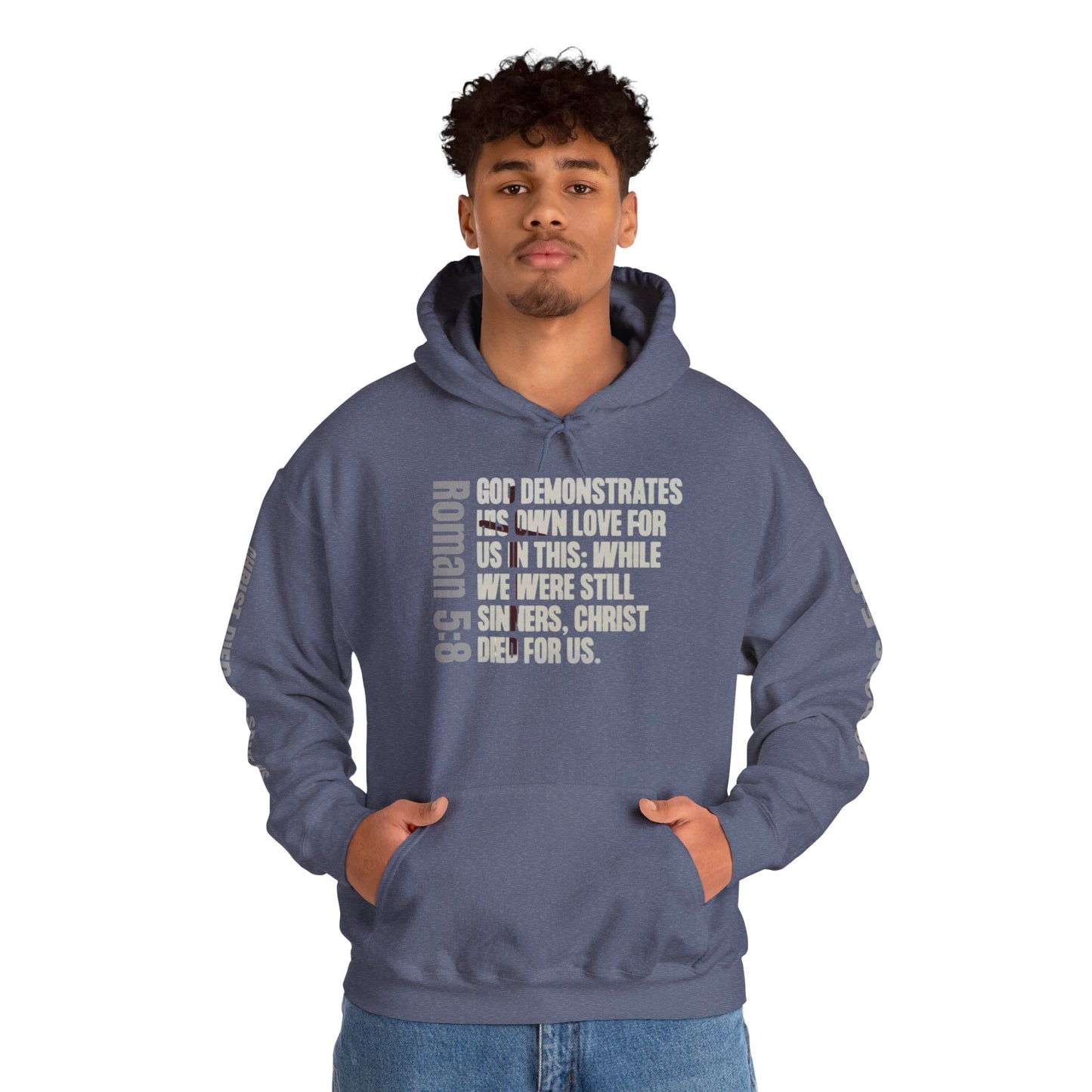 Logos Co. Romans 5:8 faith hoodie in indigo blue with scripture text on front and sleeves worn by a man