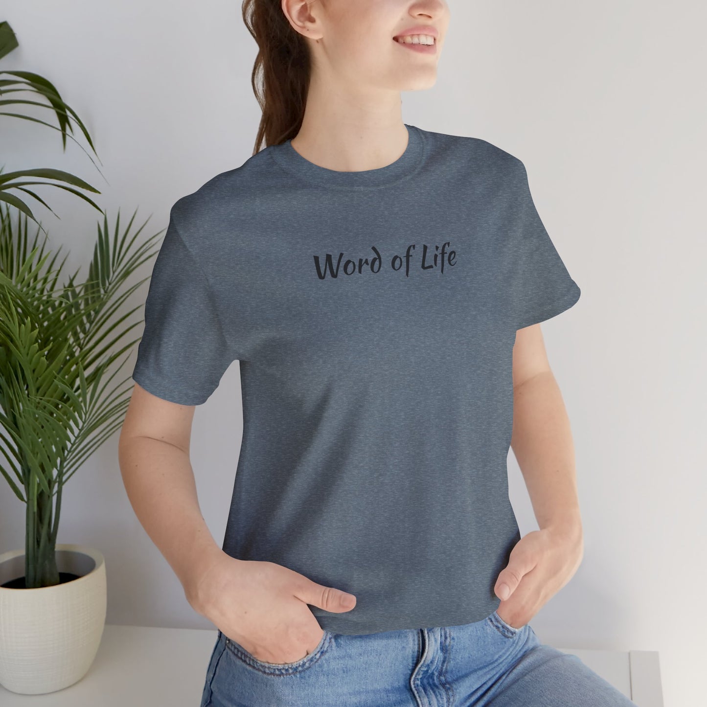 Woman wearing a gray Word of Life Christian shirt with short sleeves and casual fit