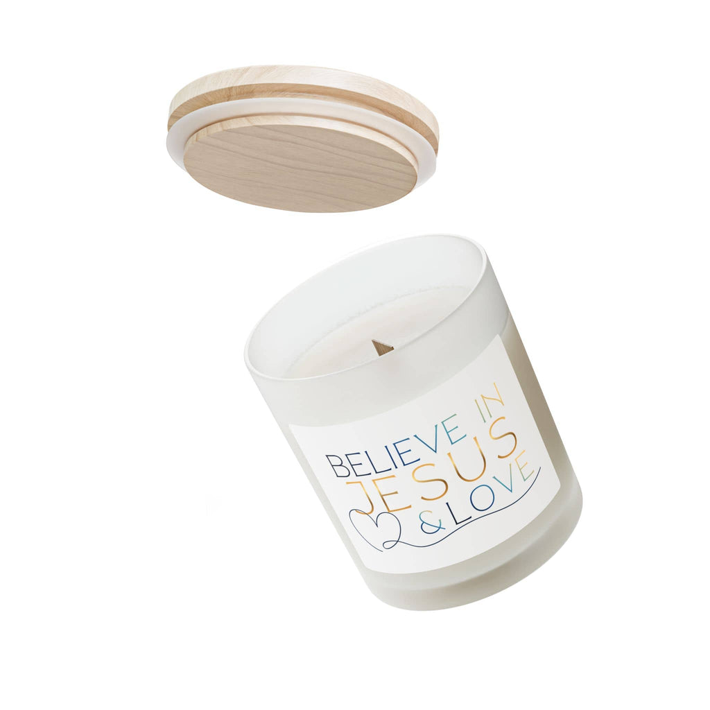 Frosted glass candle featuring 'Believe in Jesus & Love' in colorful text with a wooden lid
