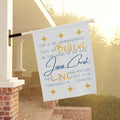 Decorative Bible verse house flag with text about love and belief, designed for outdoor display