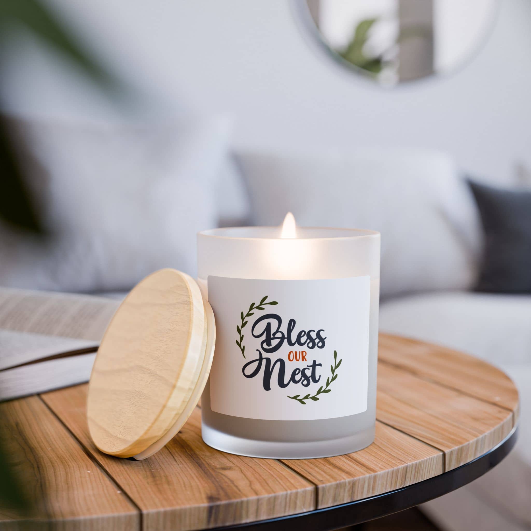 Bless Our Nest Frosted Glass Candle with a natural wooden lid, set on a wooden table in a cozy living space