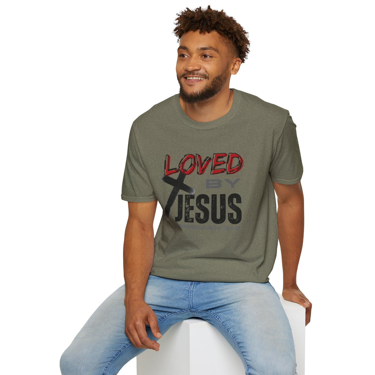 Man wearing heather military green Christian graphic t-shirt with Loved by Jesus text and cross design
