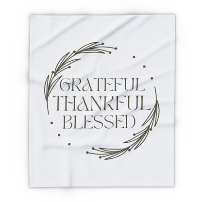 Christian home decor blanket featuring the words Grateful Thankful Blessed with a simple design
