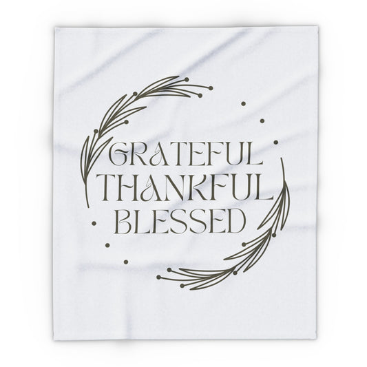 Christian home decor blanket featuring the words Grateful Thankful Blessed with a simple design