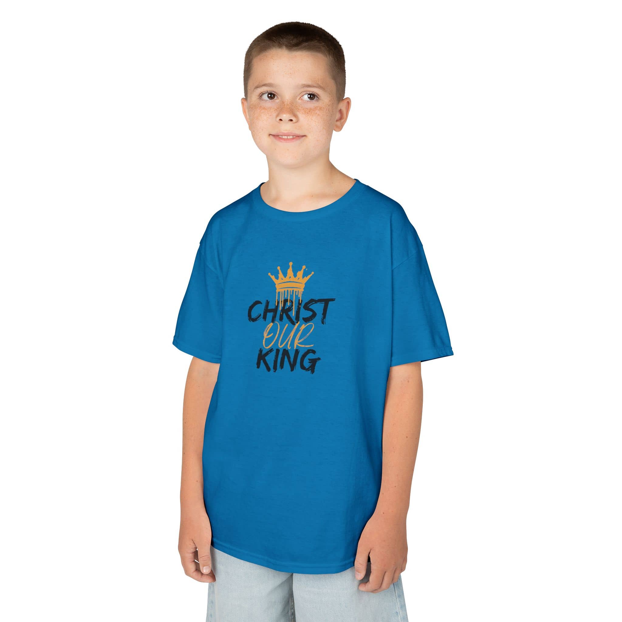 Blue Christian junior kids t-shirt with Christ Our King text and crown design worn by boy