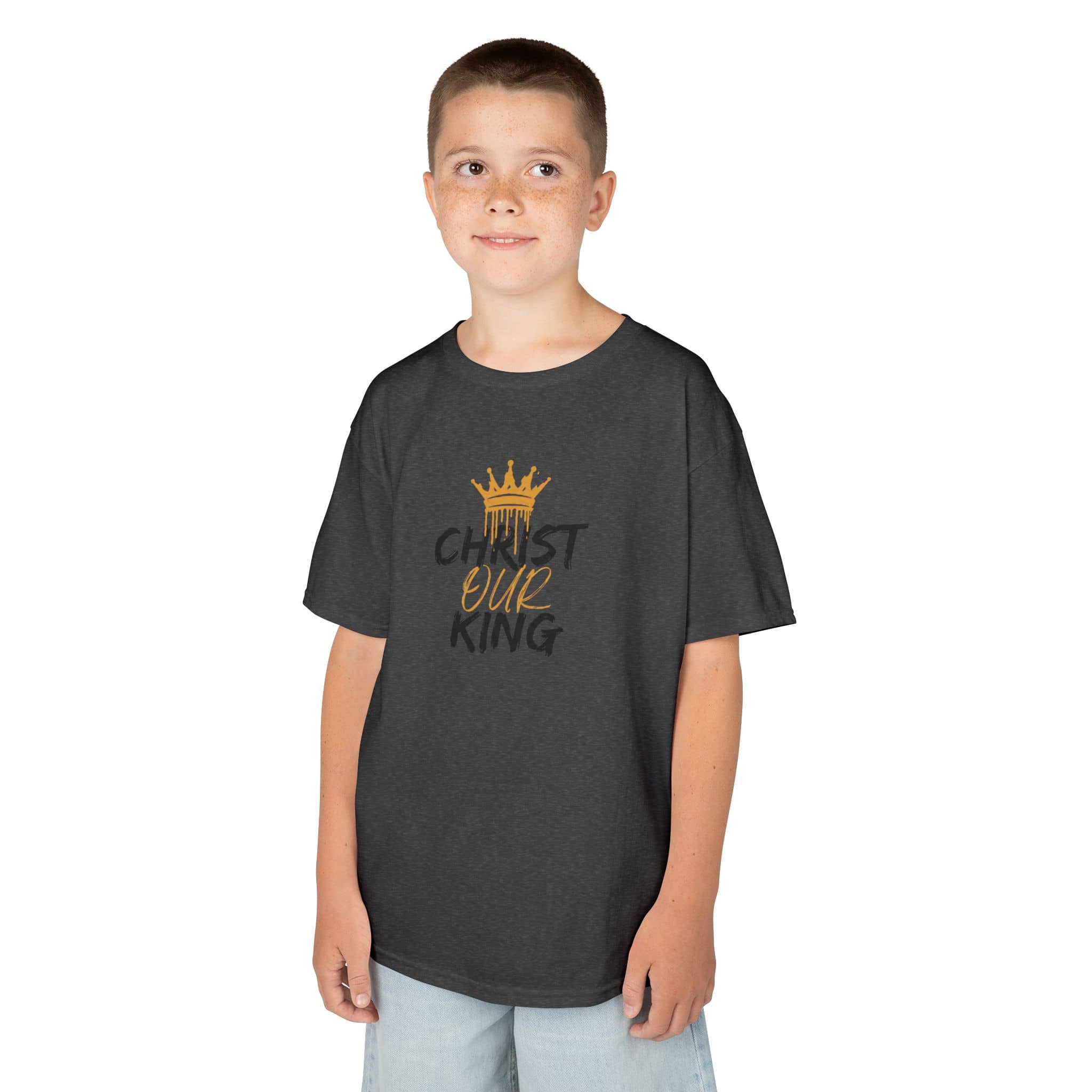 Christian junior kids t-shirt in charcoal gray with gold crown and text design worn by boy