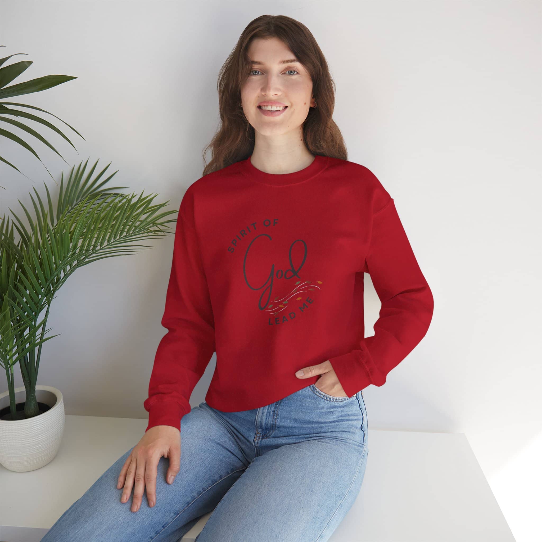 Logos red Christian women's sweatshirt with Spirit of God design worn by a woman