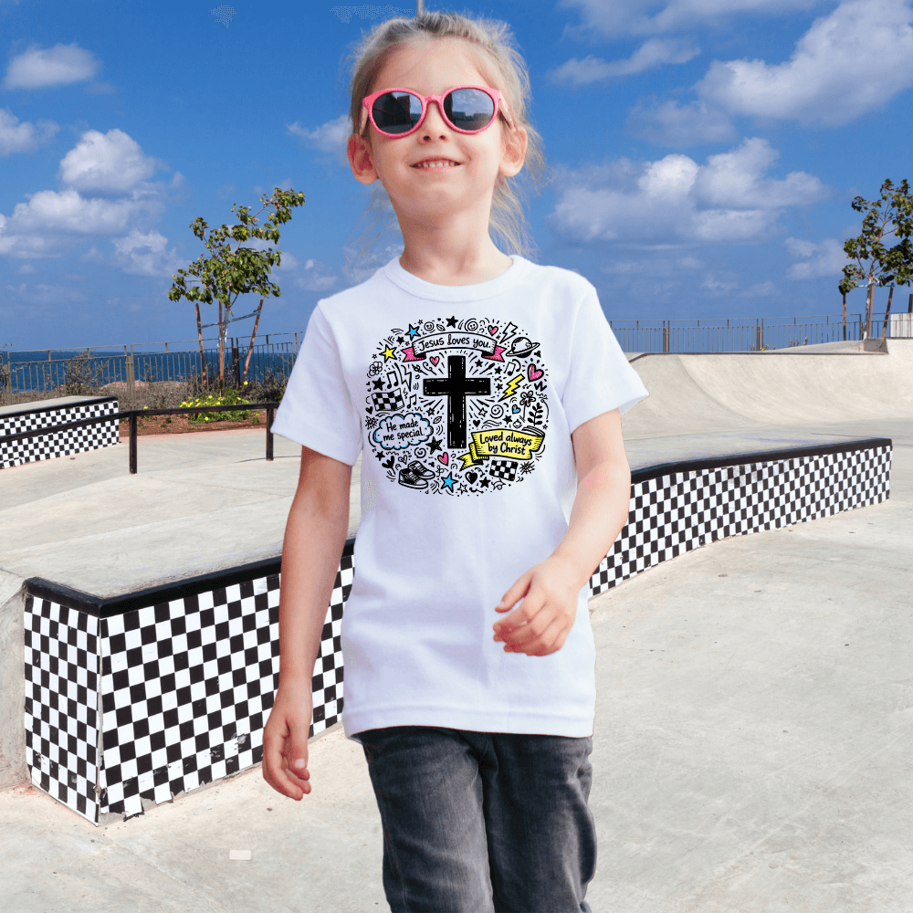 Kids white cross doodle christian tee shirt with colorful designs on the front
