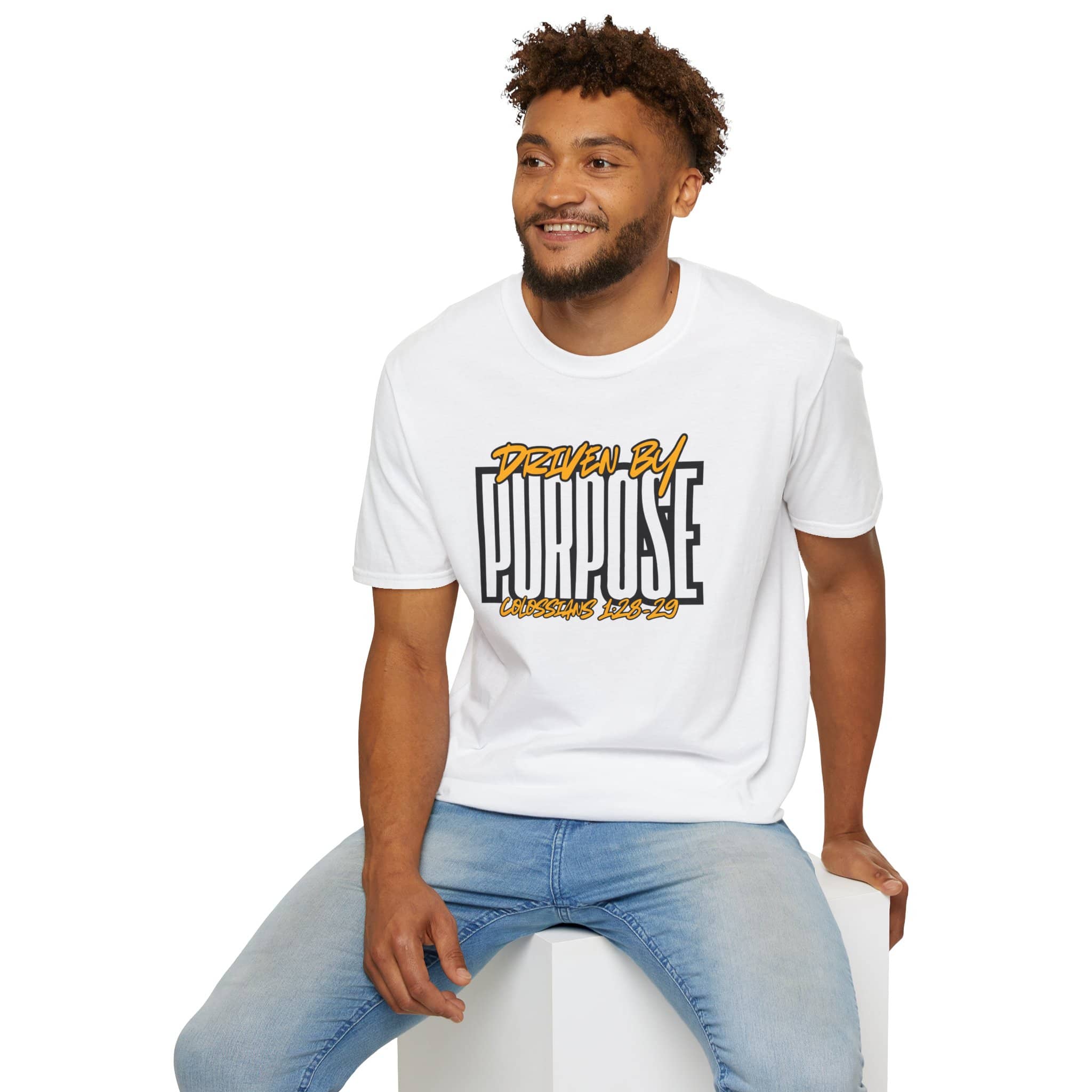 Driven By Purpose shirt in white with bold text design, front view worn by a smiling man