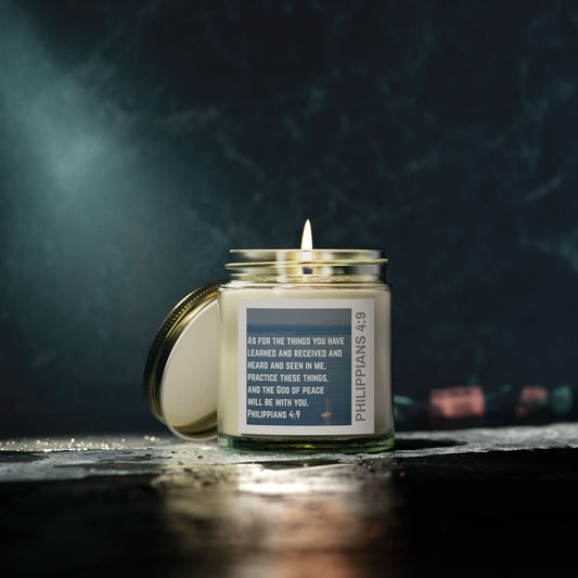 Eco-friendly Christian candle by Logos with scripture Philippians 4:9 in a glass jar with lit wick
