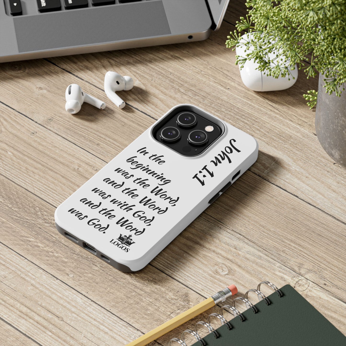 Faith-based tough phone case with inspirational text and design on a wooden desk