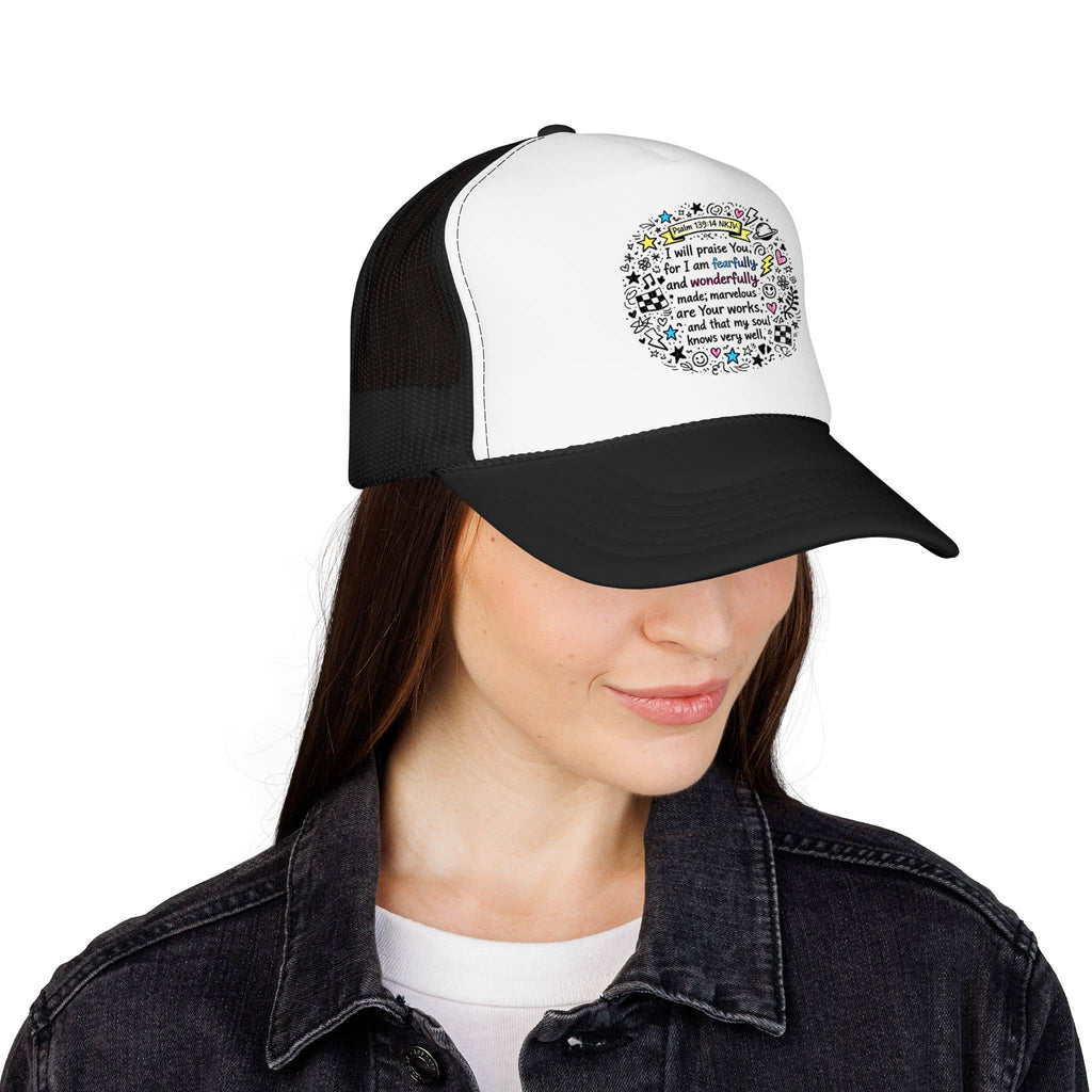Trucker hat with 'Fearfully And Wonderfully Made Hat' design in black and white, front view on a model
