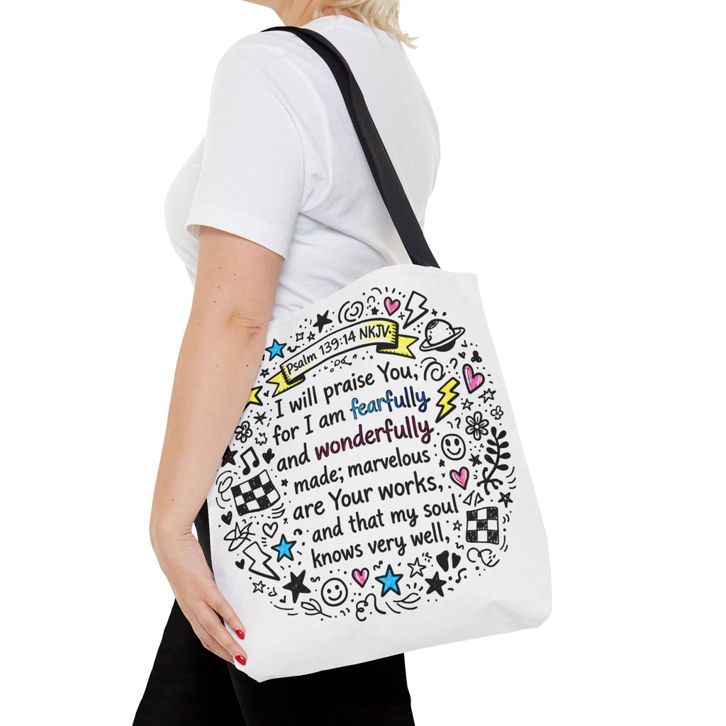 Canvas tote bag featuring 'Fearfully and Wonderfully Made' design in colorful artwork, front view