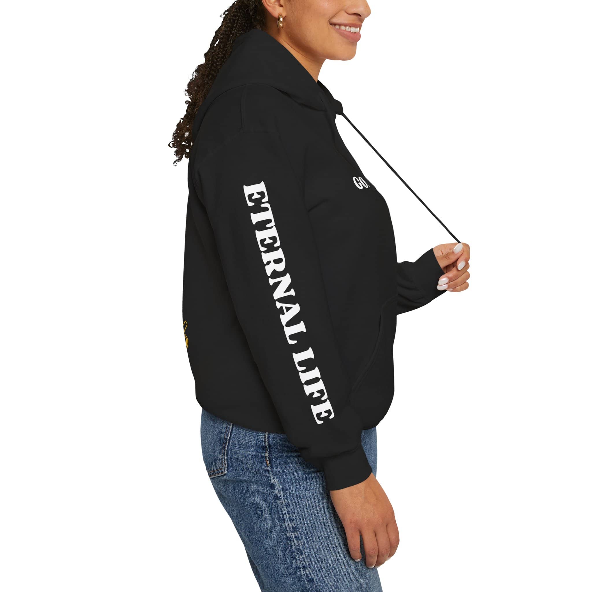 Woman wearing a black For God So Loved hoodie featuring 'ETERNAL LIFE' text on the sleeve