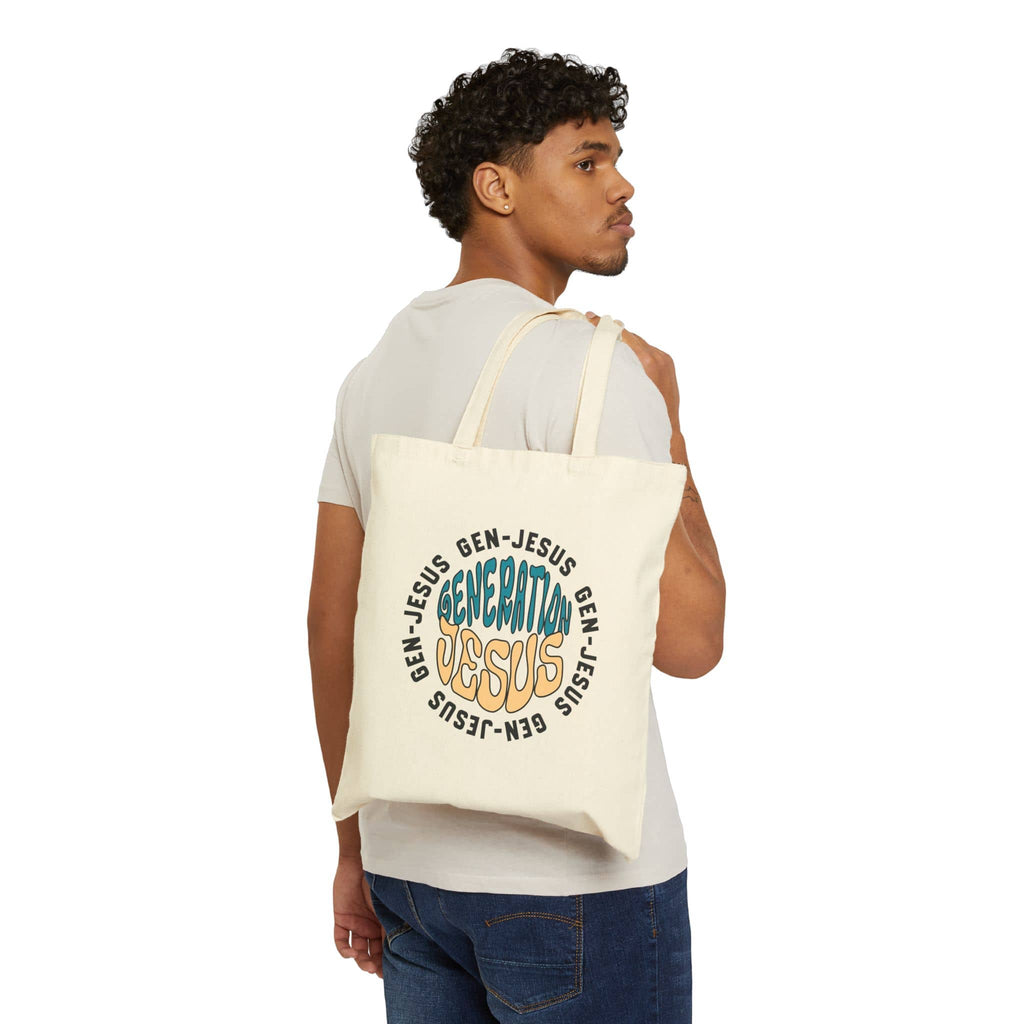 Canvas tote bag featuring the phrase Generation Jesus in multicolor on a natural background, shown from the back