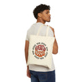 Canvas tote bag featuring the phrase Generation Jesus in vibrant colors, shown from the back on a model