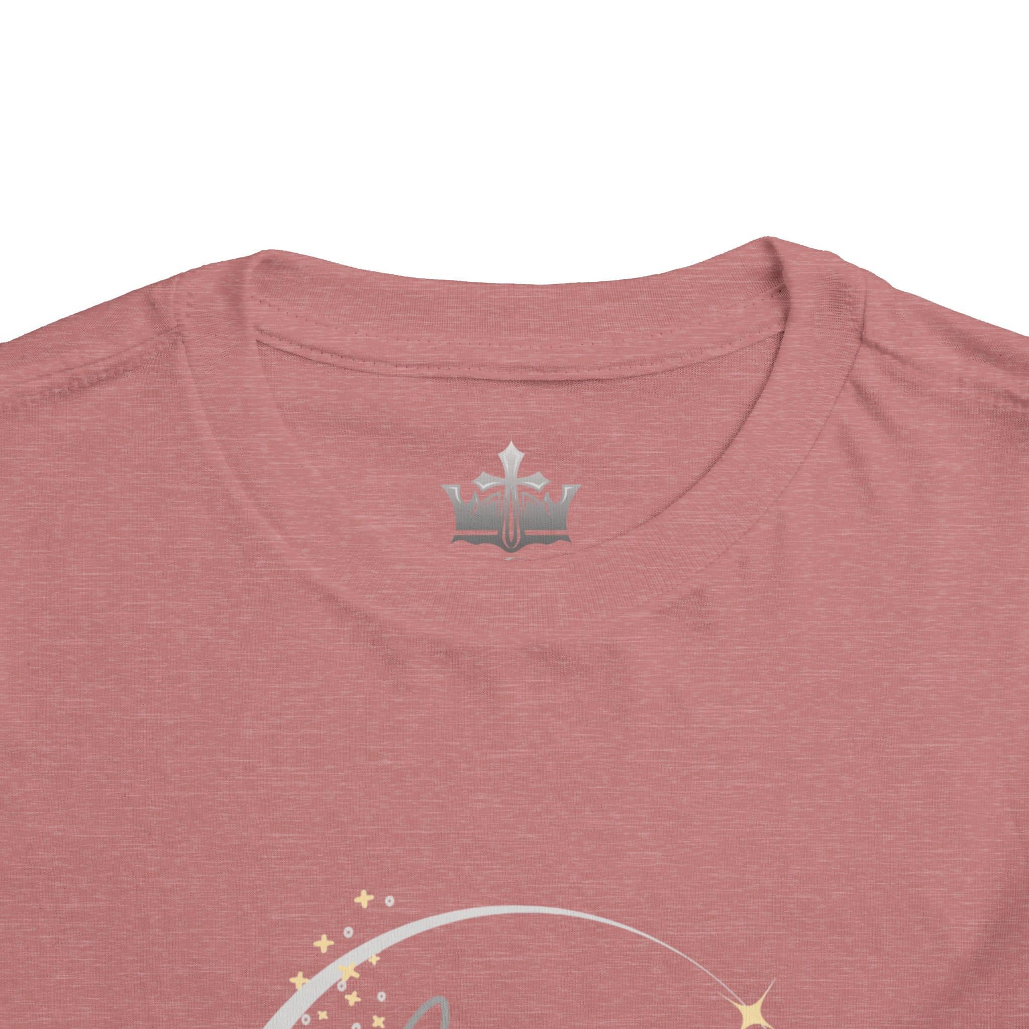 Close-up of a pink girls scripture tee from Logos showing soft fabric and round neckline