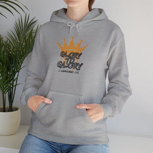 Gray Glory to Glory hoodie with orange crown graphic and 2 Corinthians 3:18 text worn by a woman
