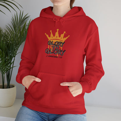 Red Glory to Glory hoodie with yellow crown graphic and front pocket worn by person sitting indoors
